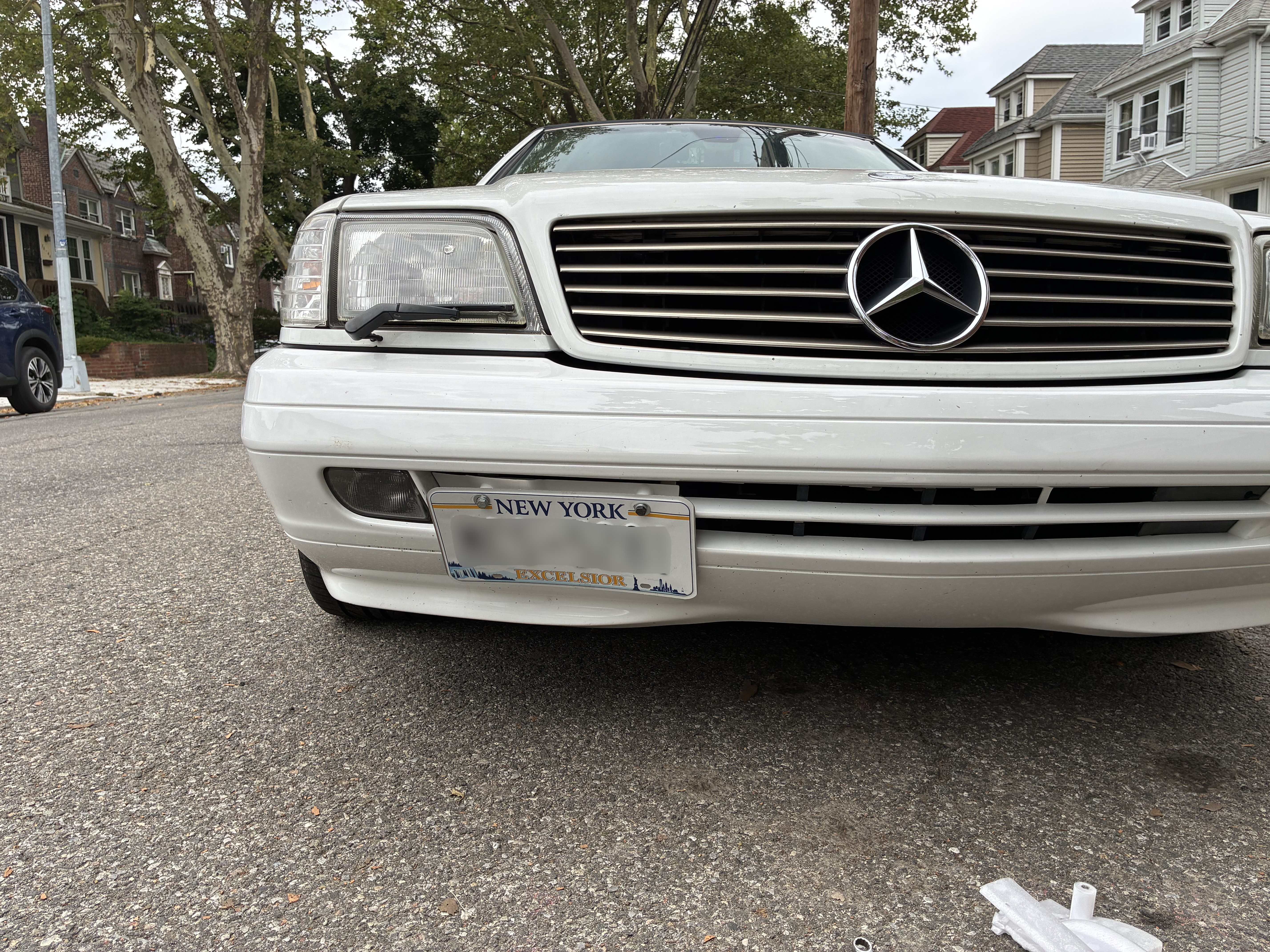 R129 Facelift Front Bumper Tow Hook Cover with License Plate Mount thumbnail