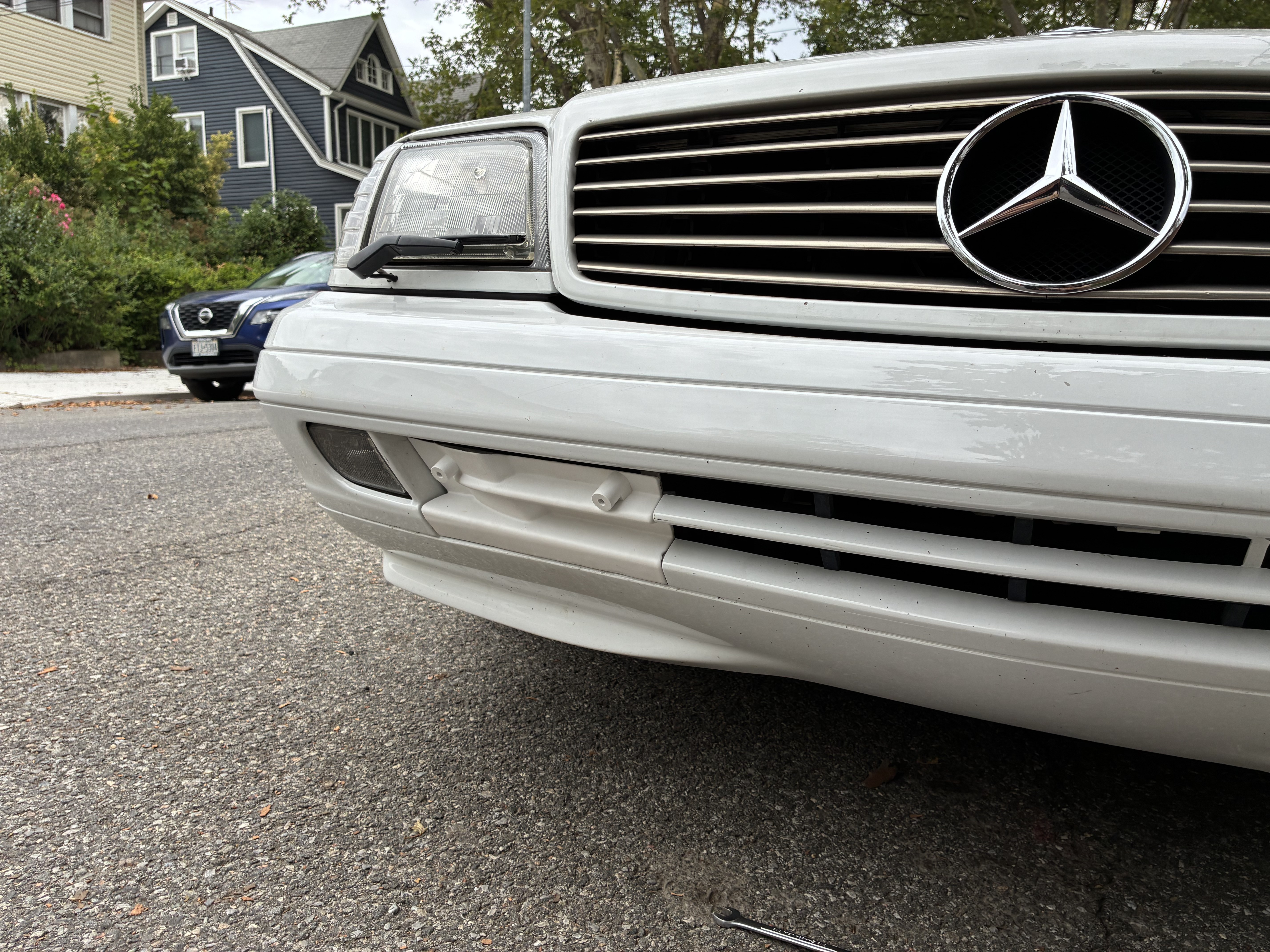 R129 Facelift Front Bumper Tow Hook Cover with License Plate Mount thumbnail